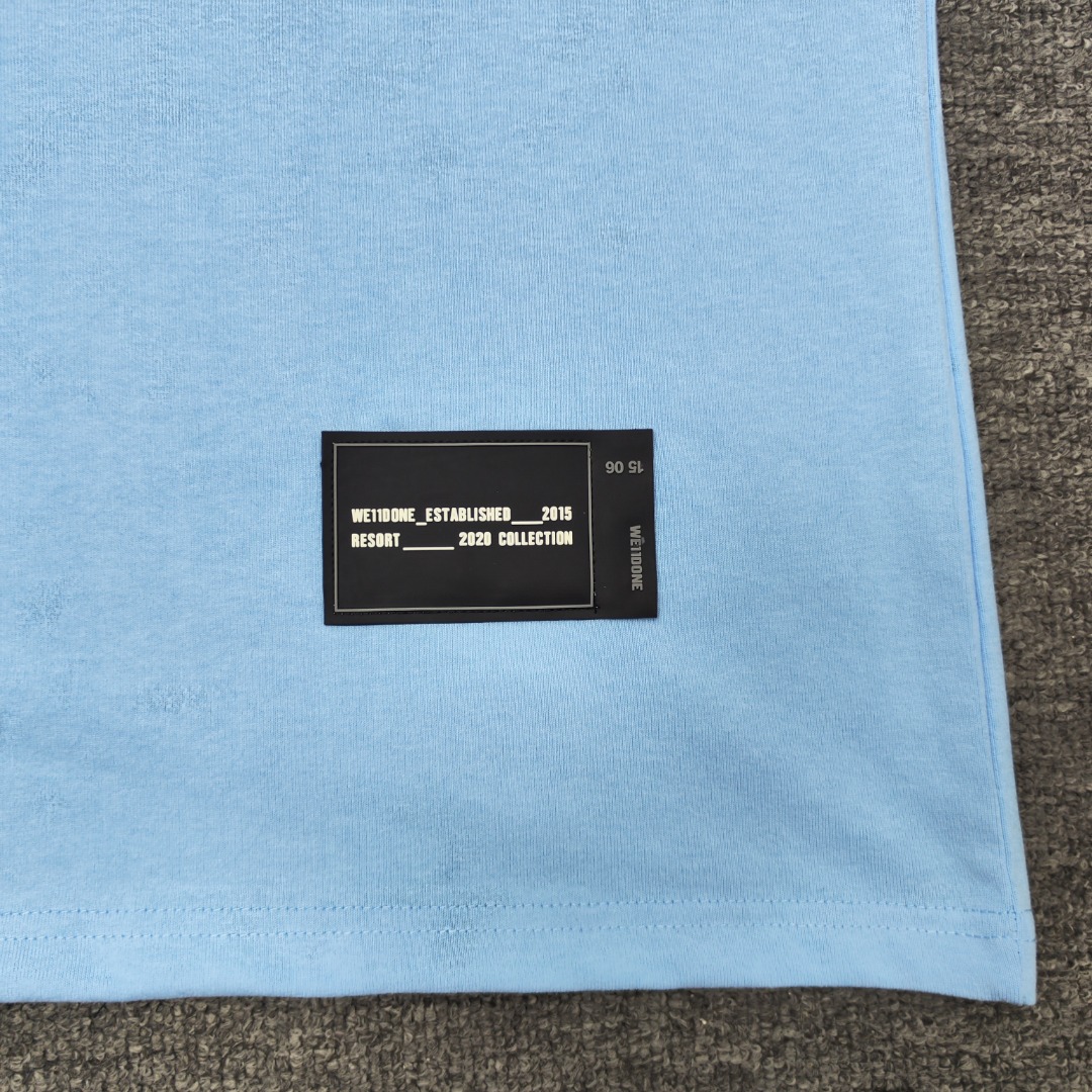 WE11D0NE Embroidered Logo Simple Color T-Shirt